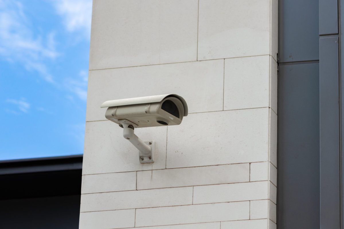 surveillance-camera-built-into-stone-wall-building-min